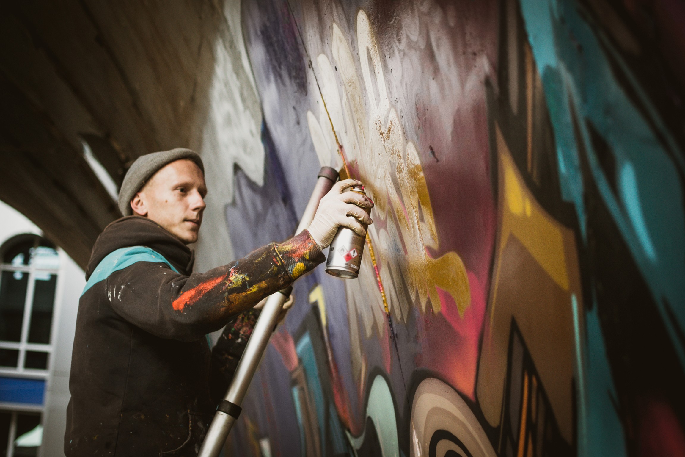 Sneakers Graffiti artist painting a wall