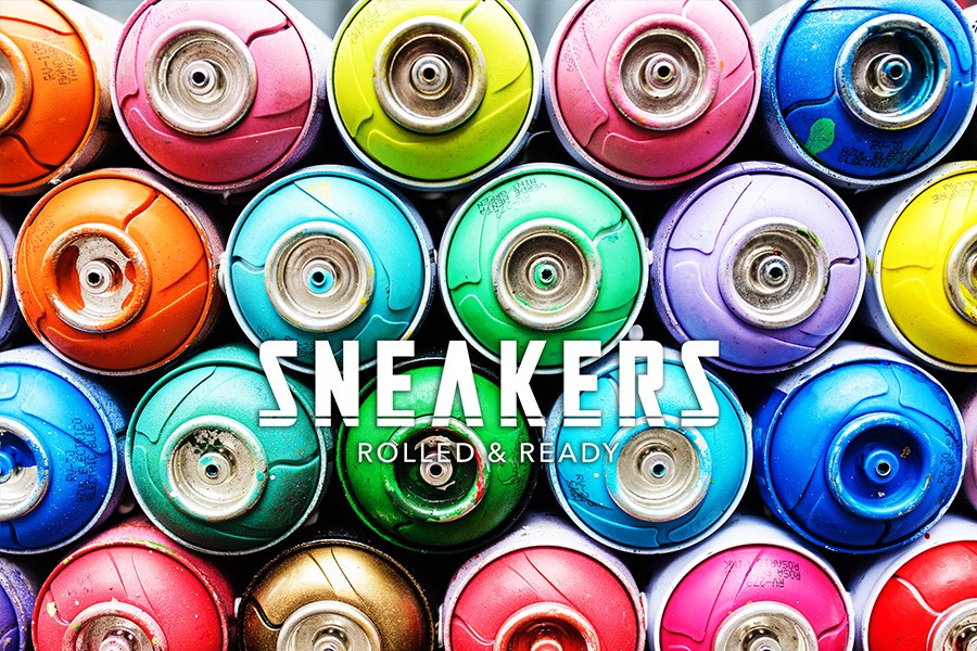 sneakers rolled and ready with different colored cans as background
